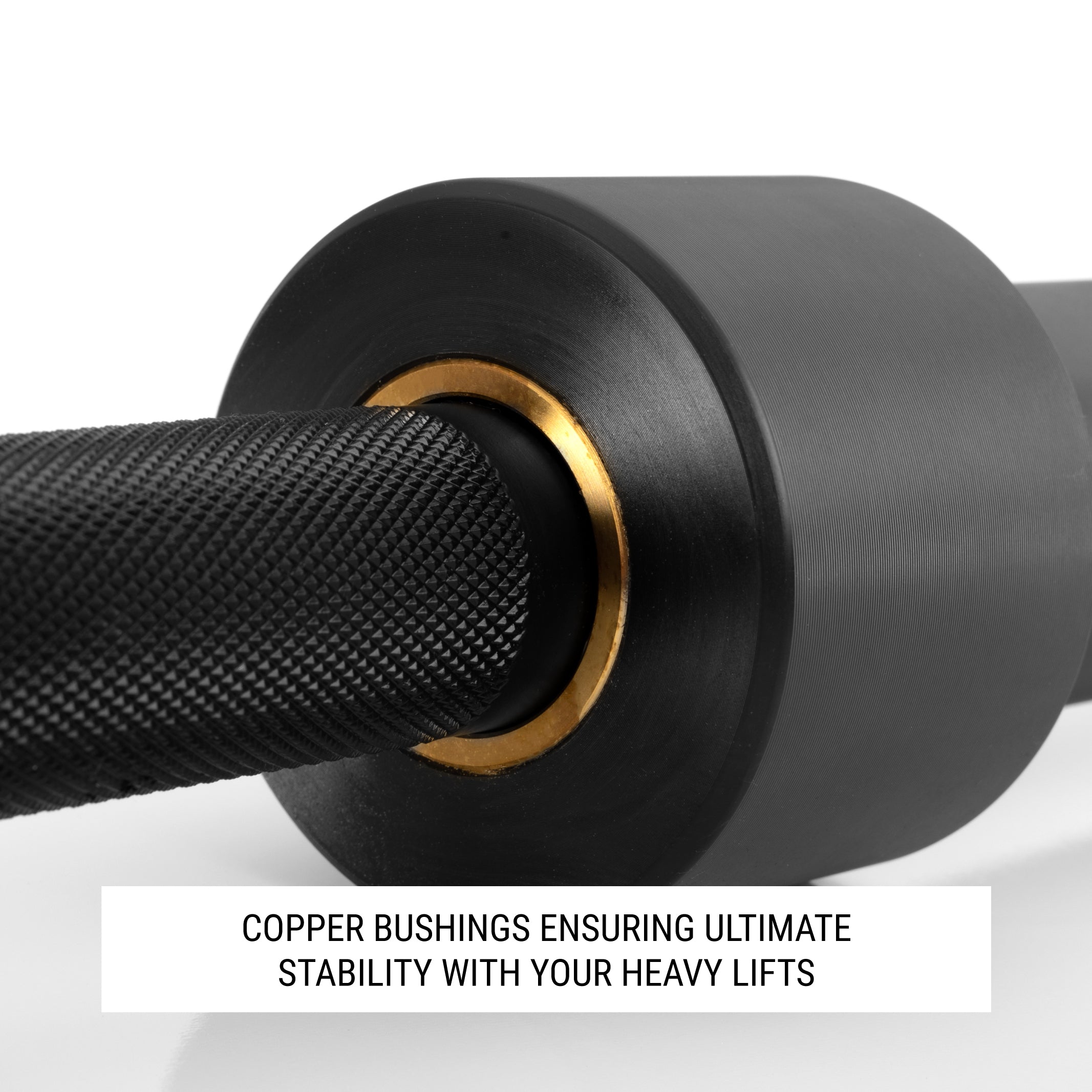 Close up of bushing on barbell sleeve with text that calls out copper bushings for stability.